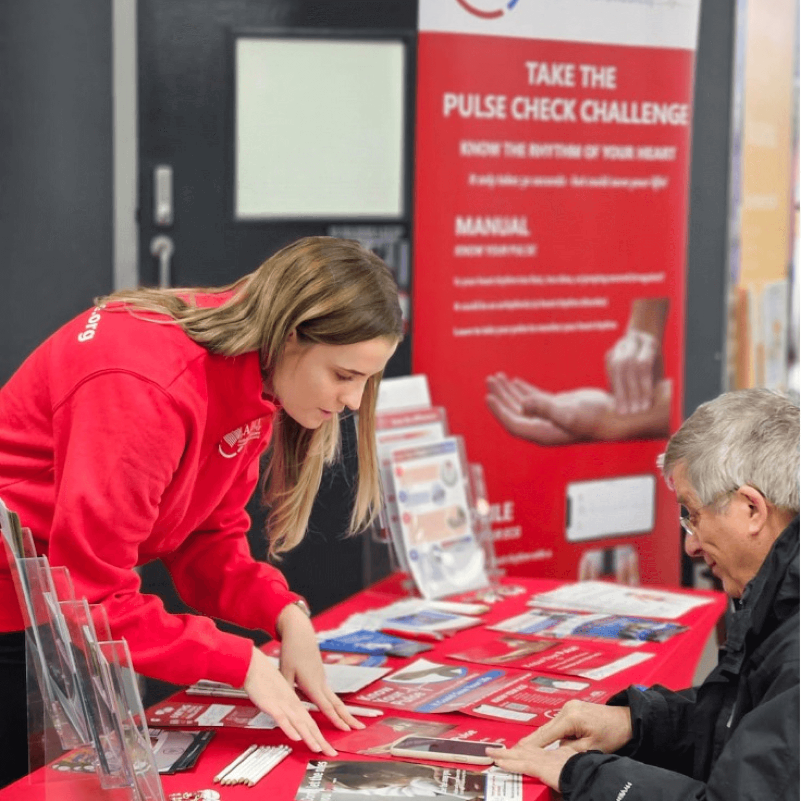 Two people at information desk